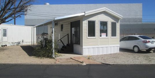 Great Snowbird home in central adult park. Low Space rent $375.00