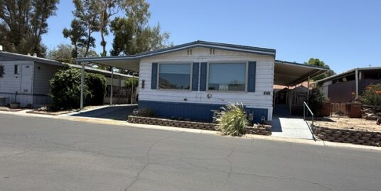 Exclusive Swan Lakes, gated 55+ Adult Park in NW Tucson has 1784 sq ft home on the Lake